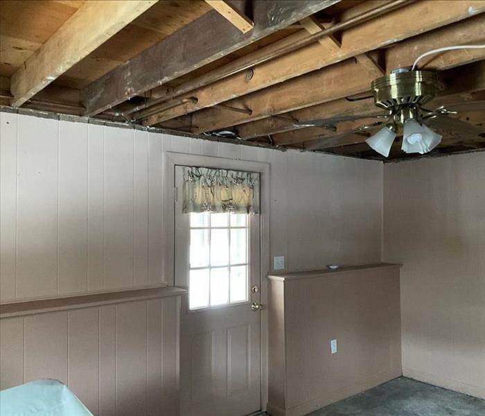 In the After Photo, meanwhile, SERVPRO professionals successfully removed the sheetrock and insulation and cleaned subfloorin
