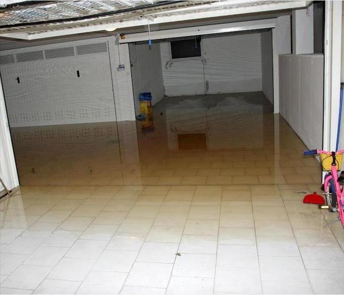 water damaged basement with bikes