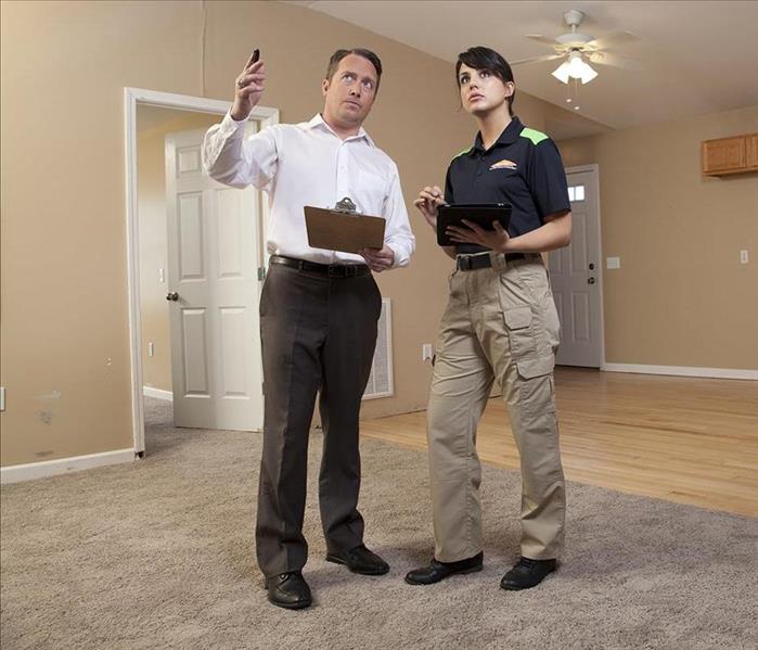 Man consulting with SERVPRO technician
